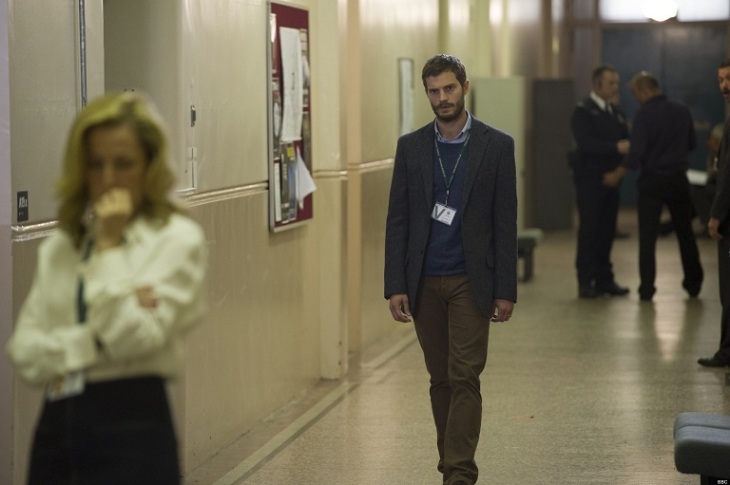 Serial killer Paul Spector (Jamie Dornan) watches Detective Superintendent Stella Gibson (Gillian Anderson) with great interest.